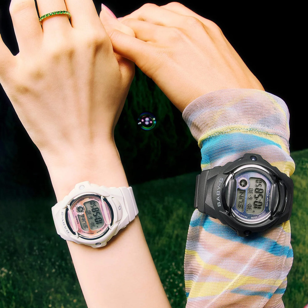 The Casio Baby-G Digital Women's Watch BG169GD-1D, 42mm case, worn alongside the Casio Baby-G Digital Women's Watch BG169GD-7D on a second wrist. The matte black and off-white colourways are shown side by side for comparison.