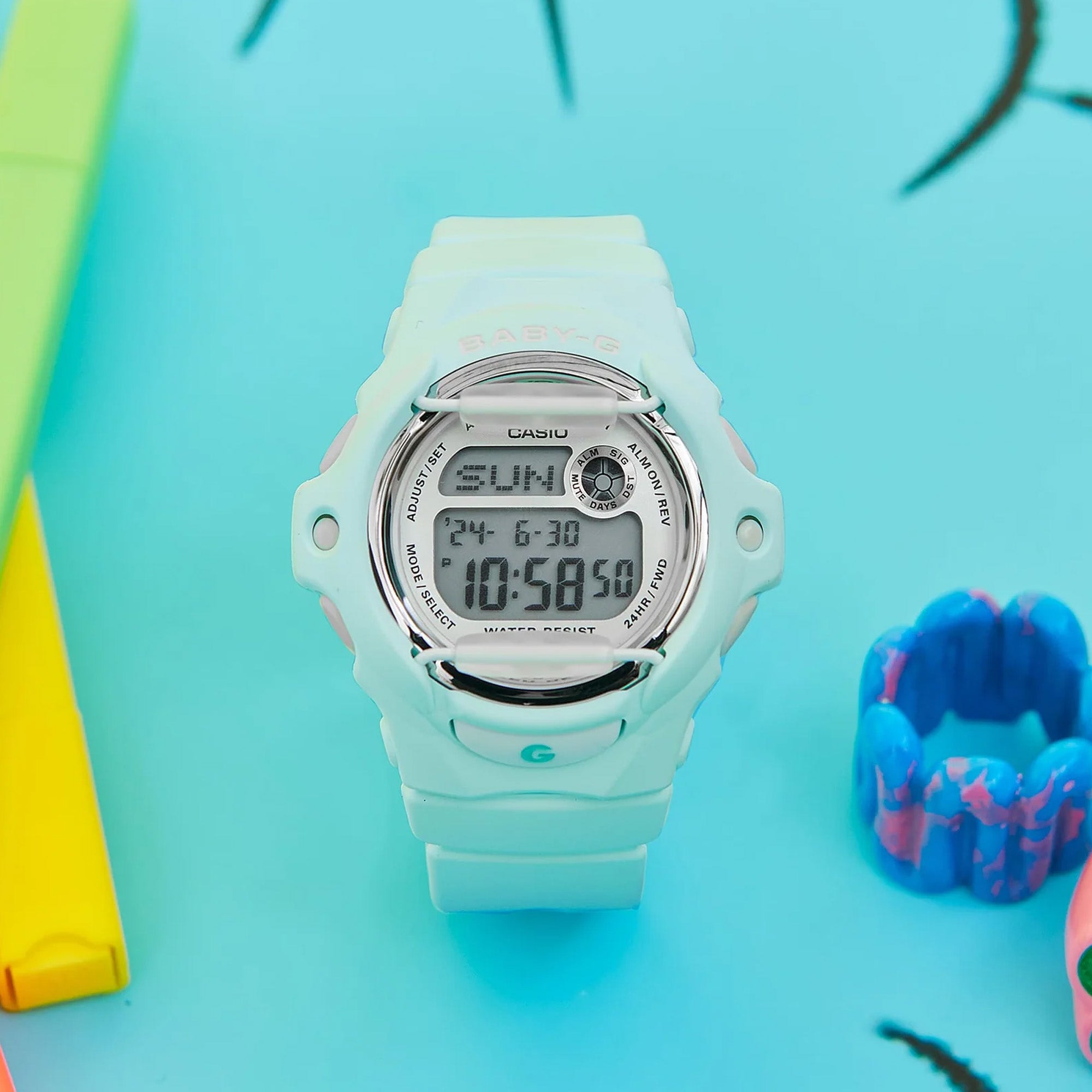 Casio BABY-G BG169U-3D digital watch with green resin band, compact round case, and shock-resistant sporty design.