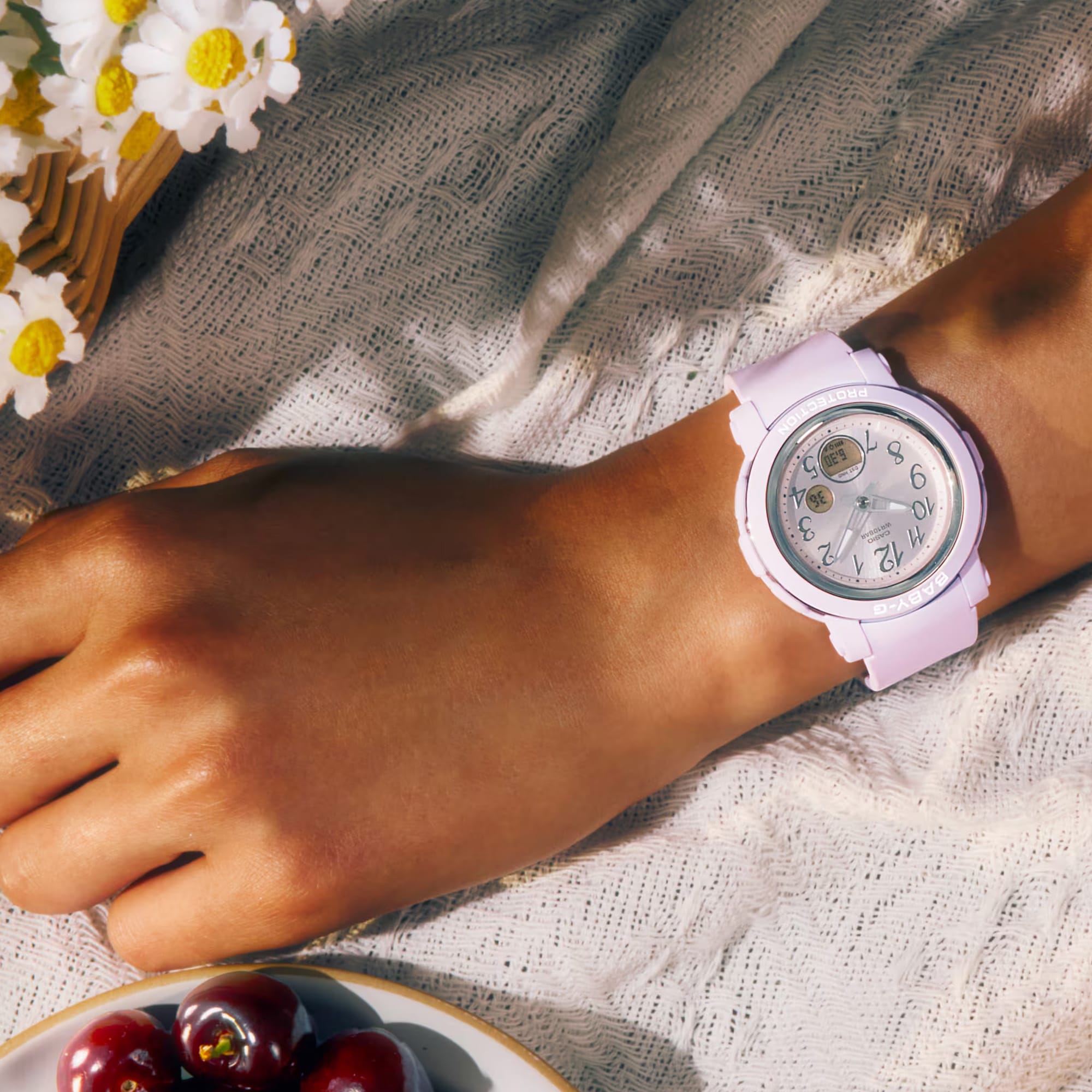 The Casio Baby-G BGA290SA-6A reveals the glossy metallic vapour deposition bezel ring finish, metallic Arabic numerals, and the hand shift feature on the analogue-digital wide-face dial in close detail.
