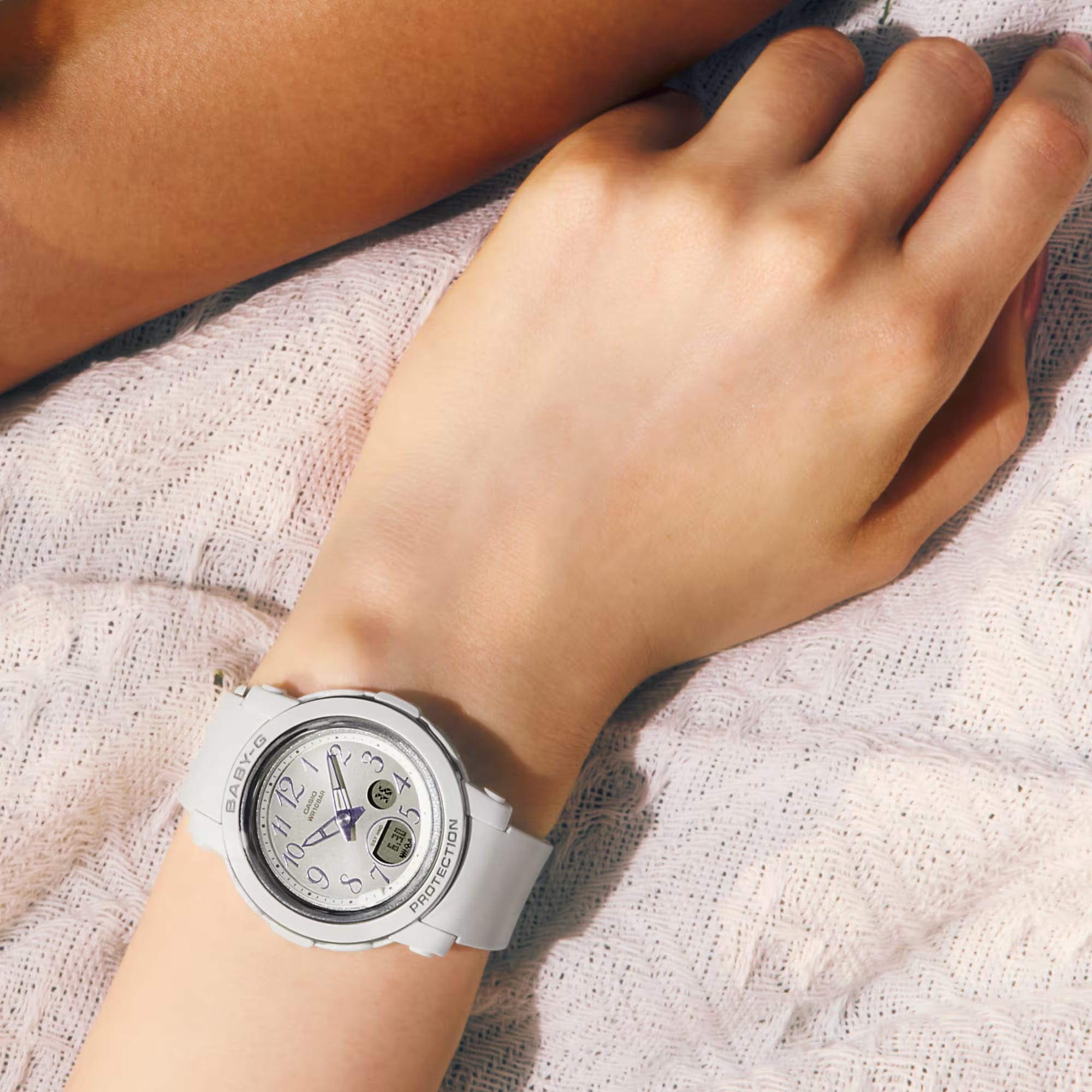 The Casio Baby-G BGA290SA-7A shows its ultra-slim 10.1mm profile with soft white resin case, glossy vapour deposition bezel ring, and crown positioned on the case side.