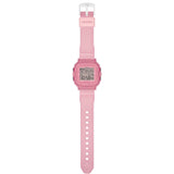The Casio Baby-G BGD10KG-4D is fitted with a translucent pink glitter resin band with the included customisable silicone holder with acrylic panels shown alongside, confirming shock-resistant and 100-metre water-resistant construction.