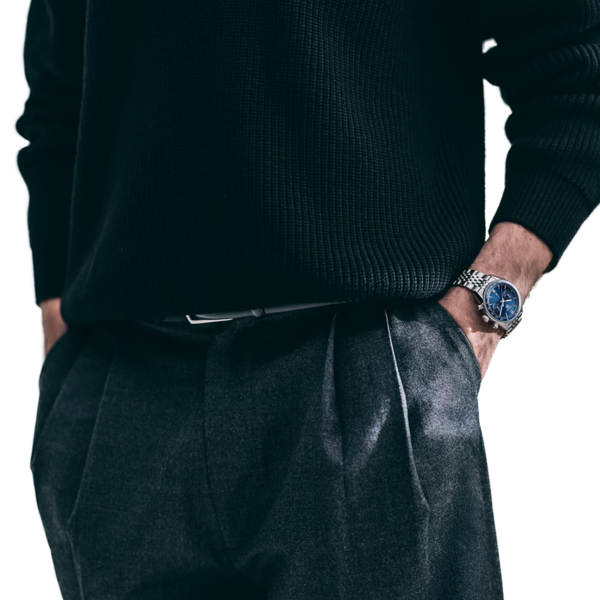 TAG Heuer Carrera Chronograph CBS2212.BA0048 shown worn on the wrist, illustrating the case proportions and steel bracelet fit. The blue dial stands out against the sleeve in frame.