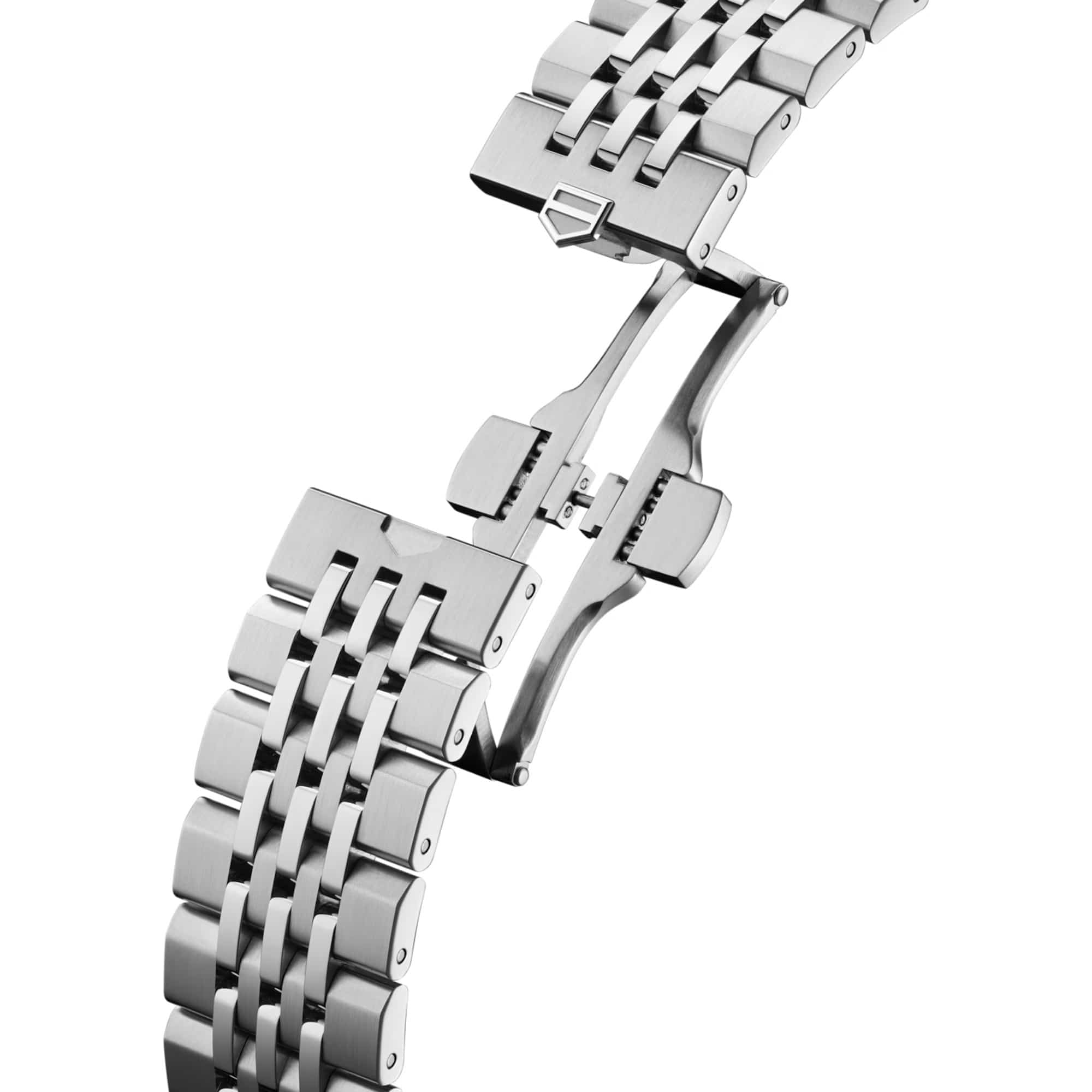 TAG Heuer Carrera Chronograph CBS2216.BA0048 photographed in close-up focusing on the 7-row beads-of-rice steel bracelet's link detailing. The case is partially visible at the top of the frame, connecting to the bracelet via the lugs.