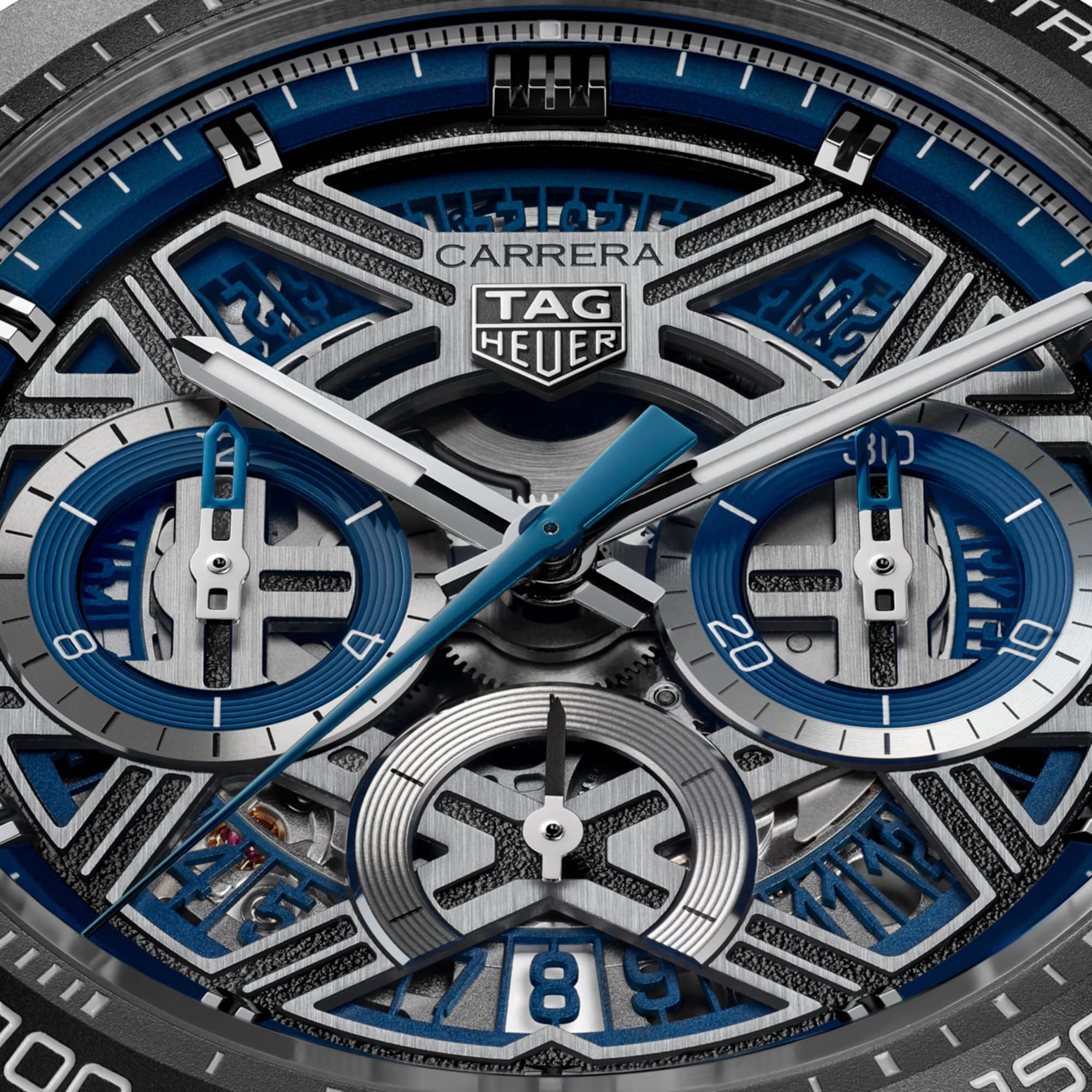 TAG Heuer Carrera Chronograph Extreme Sport CBU2081.BF0007 captured in extreme close-up on the openworked dial, revealing the movement components framed by the blue flange. The rhodium-plated hands and indexes with Super-LumiNova sit against the skeletonized dial.