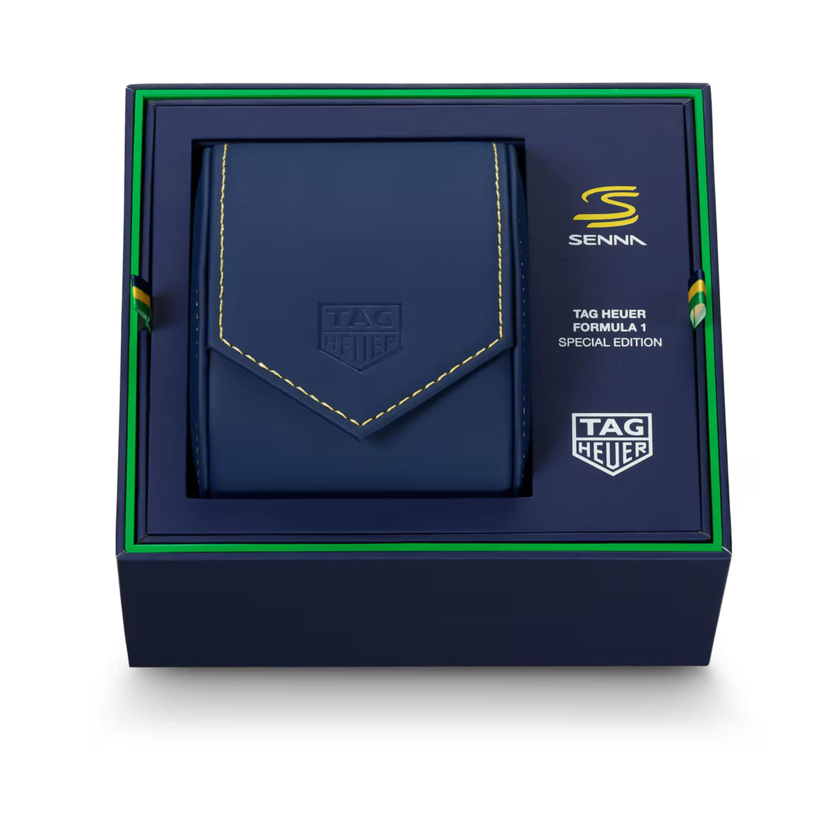 A Senna x Tag Heuer Formula 1 Special Edition leather wallet in navy blue, presented inside its branded dark blue gift box with green trim.