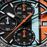 TAG Heuer Formula 1 Chronograph x Gulf CBZ208B.BF0009 captured in extreme close-up on the black opalin dial, highlighting Gulf's blue and orange racing stripes across the chronograph subdials. The forged carbon bezel frames the dial edge.