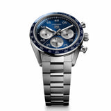 A luxury wristwatch featuring a stainless steel link bracelet, a blue dial with three subdials, and a blue and white bezel, shown on a clean white background.