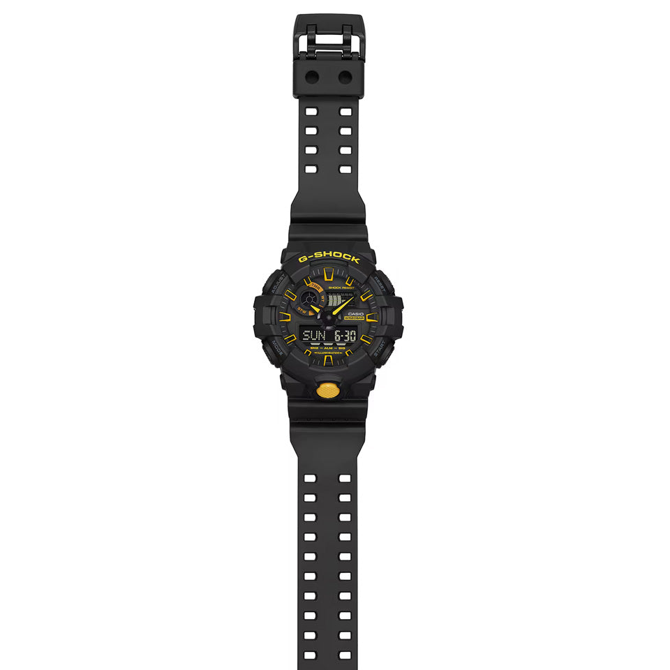 Casio G-SHOCK GA700CY-1A analogue digital watch with black resin band, oversized black and yellow dial, and shock-resistant design.