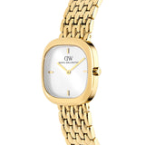 Three-quarter angle view of the Daniel Wellington Corta Grain-Link Women’s 24mm Quartz Watch DW00100993, highlighting the soft square edges of the petite gold cushion case. The white sunray dial and textured gold bracelet are visible from this angle.