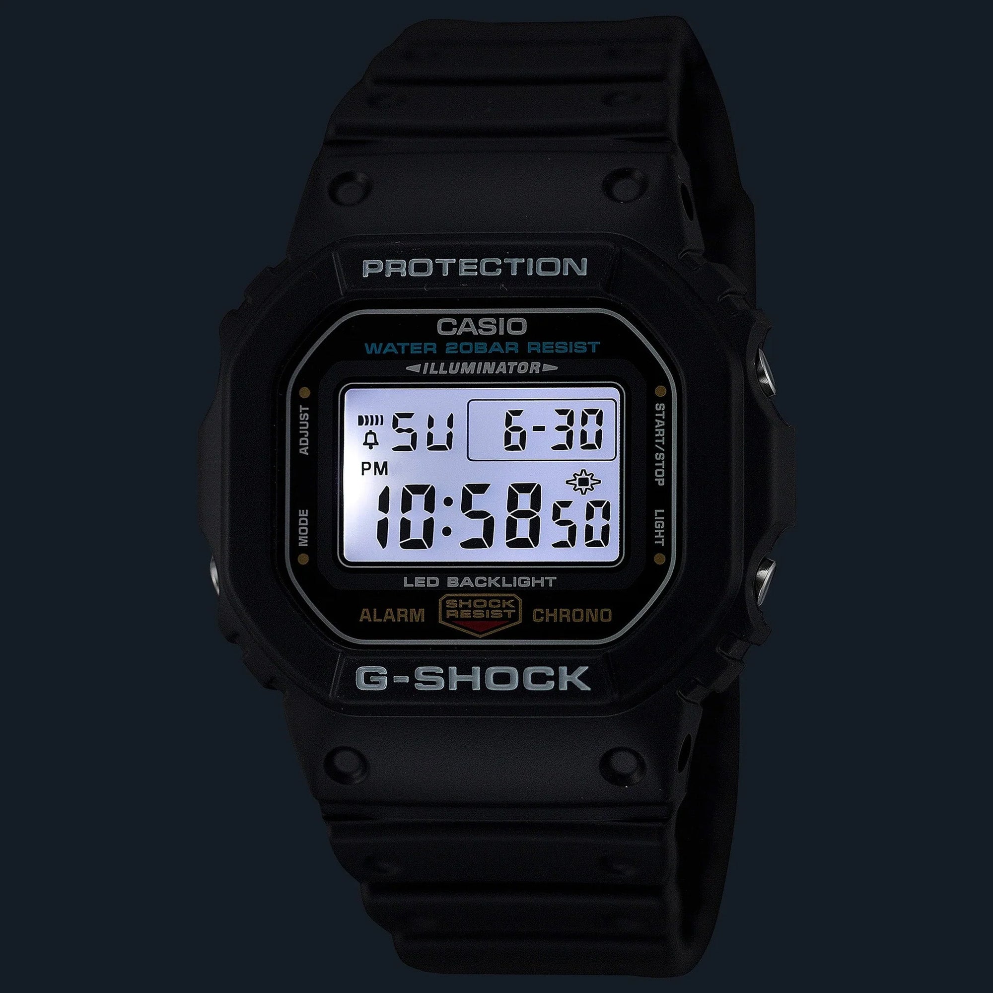 Casio G-Shock DW5600UE-1D front view — all-black square matte resin case, rectangular five-line LCD display. Images shows the blacklight in a dark background