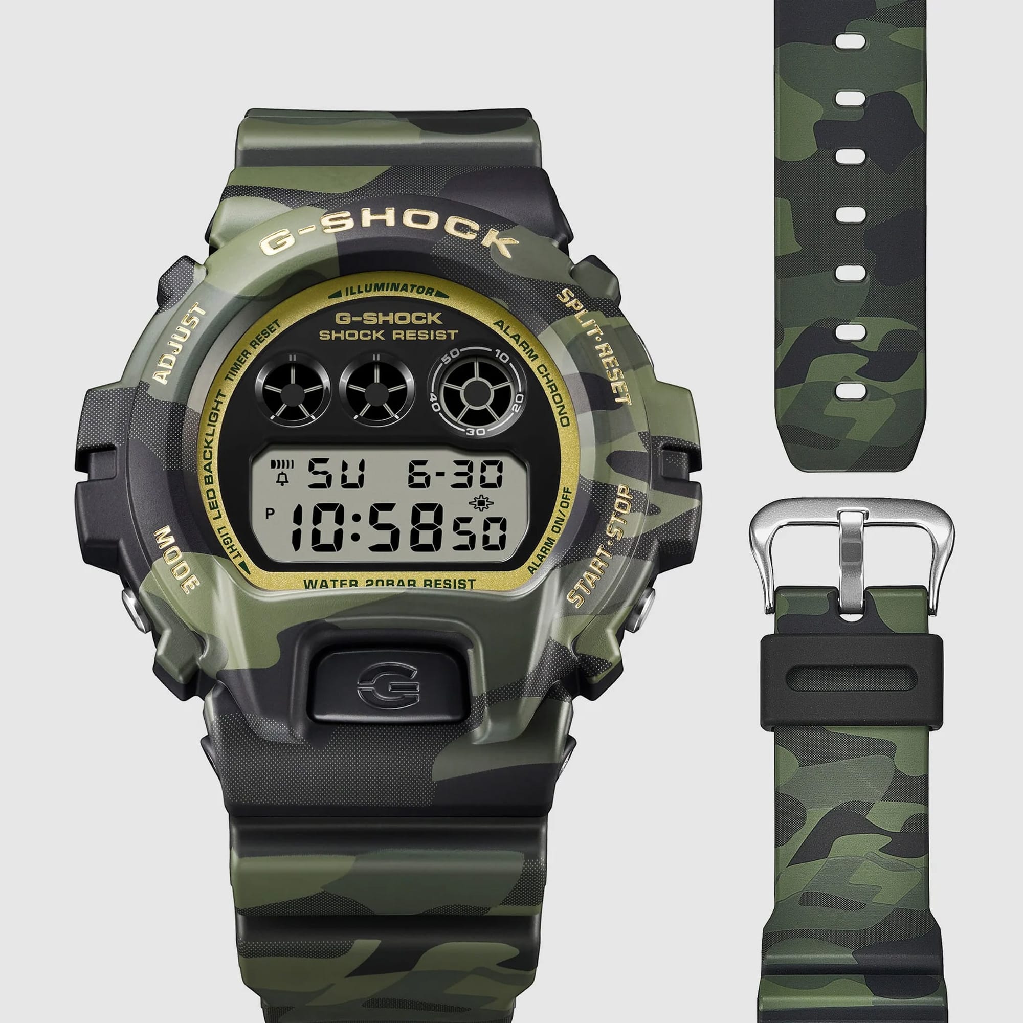 Casio G-Shock DW6900CMG-3D dial close-up showing the gold-coloured vapour deposition finish across the dial face and hands against the classic 6900 triple LCD display layout.