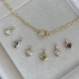 Six Wallace Bishop double bezel pendants in 9ct Yellow Gold shown in a row with chain