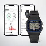 Lifestyle shot of the Casio Vintage Digital Watch F-B100W-1A styled in an active, everyday setting, reflecting its Bluetooth step-tracking function. The black resin case and blue dial accent are shown in a natural, real-world context.