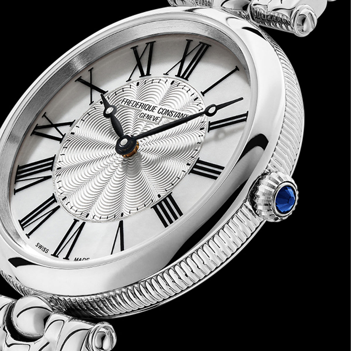 Frederique Constant Classics Art Deco Round Women's 30mm Watch FC-200MPW2AR6B styled in a lifestyle setting, reflecting its elegant, jewellery-inspired design suited to dressier occasions. The mother-of-pearl dial and polished stainless steel case complement a refined, feminine look.