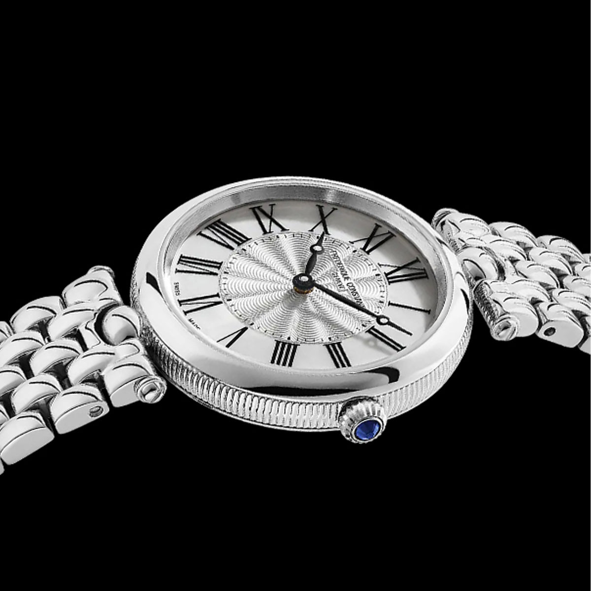 Frederique Constant Classics Art Deco Round Women's 30mm Watch FC-200MPW2AR6B demonstrating the fit of its petite 30mm case and stainless steel bracelet. The round silhouette and fine finishing sit close and comfortably on the wrist.