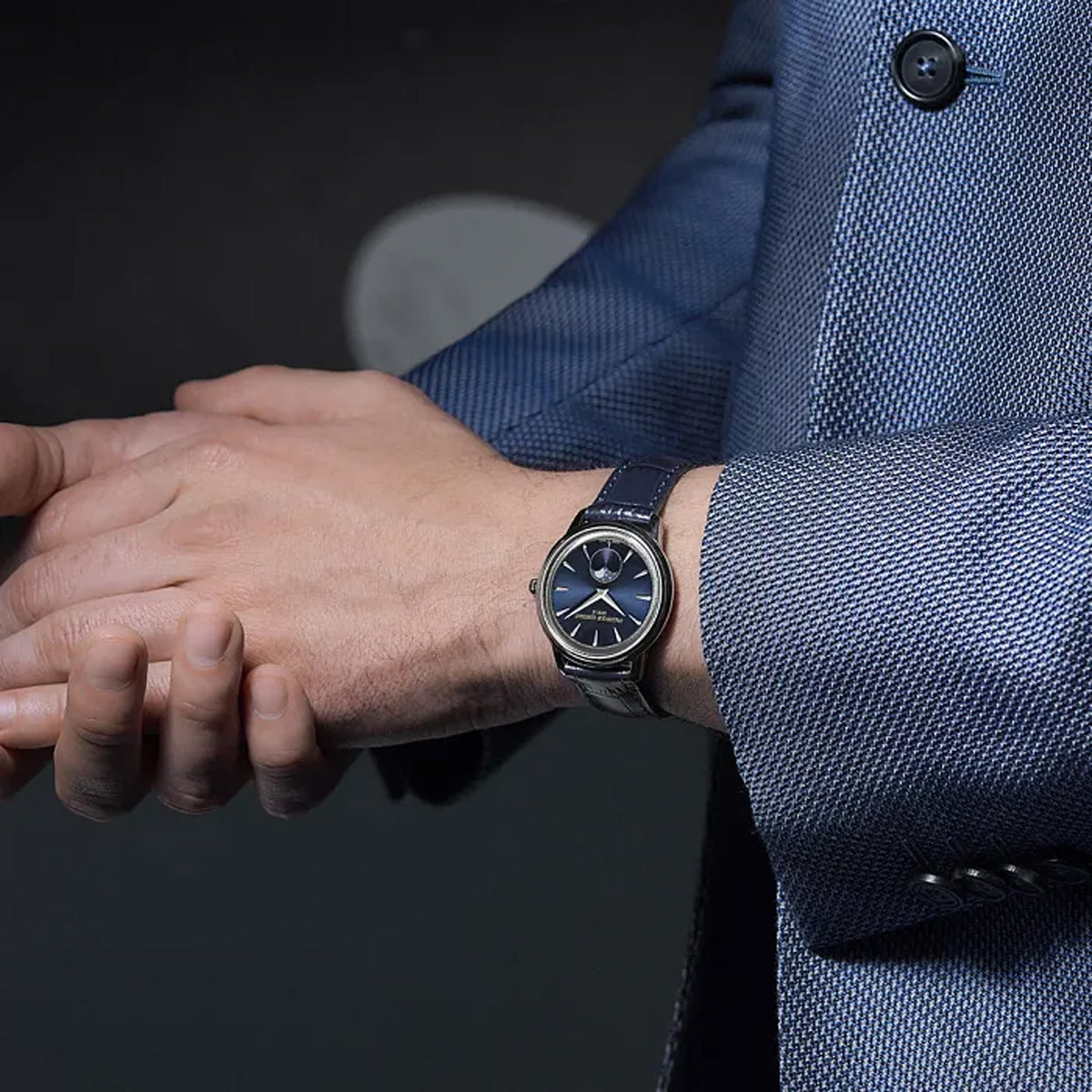 Frederique Constant 37mm Quartz Moonphase Watch FC-206N3S6 worn on the wrist, demonstrating the comfortable fit of its 37mm case and leather strap. The moonphase display adds a subtle decorative detail to the wrist.