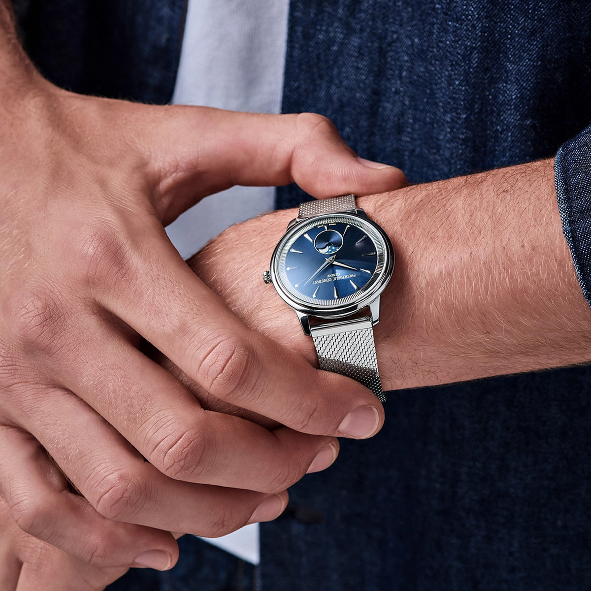 Frederique Constant Classic Quartz 37mm Watch FC-206N3S6B worn on the wrist, demonstrating the comfortable fit of its 37mm case and Milanese mesh bracelet. The moonphase display adds a subtle decorative detail to the wrist.