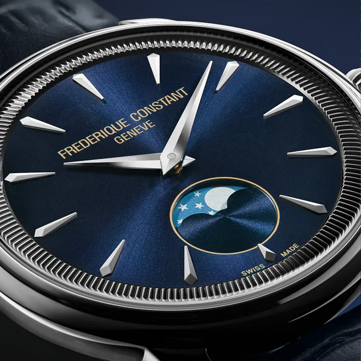 Frederique Constant 37mm Quartz Moonphase Watch FC-206N3S6 styled in a lifestyle setting, reflecting its refined, versatile design suited to both business and evening occasions. The navy blue dial and leather strap complement a sophisticated, understated look.