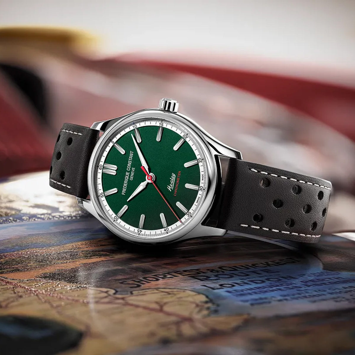 Frederique Constant Classic Men's 40mm Chronometer Watch FC-301HGRS5B6 styled in a lifestyle setting, reflecting its vintage motorsport-inspired design suited to casual and smart-casual wear. The green dial and brown leather strap suit a classic, heritage-driven look.