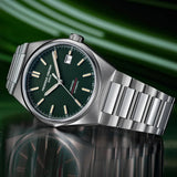Frederique Constant Highlife Automatic COSC Watch FC-303GRS3NH6B styled in a lifestyle setting, reflecting its versatile, unisex design suited to everyday and smart-casual wear. The green dial and stainless steel case complement a range of outfits.
