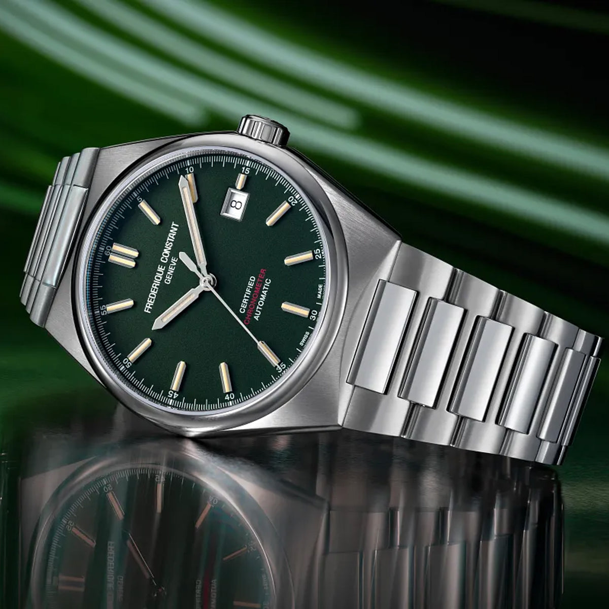 Frederique Constant Highlife Automatic COSC Watch FC-303GRS3NH6B styled in a lifestyle setting, reflecting its versatile, unisex design suited to everyday and smart-casual wear. The green dial and stainless steel case complement a range of outfits.