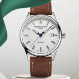 Frederique Constant Classic Automatic Men's 40mm Watch FC-303NS5B6 styled in a lifestyle setting, reflecting its refined, versatile design suited to both business and formal occasions. The silver dial and brown leather strap complement a classic, polished look.