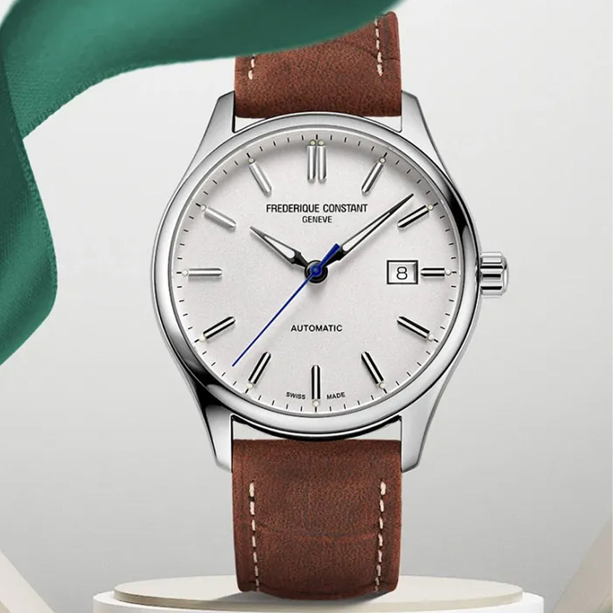 Frederique Constant Classic Automatic Men's 40mm Watch FC-303NS5B6 styled in a lifestyle setting, reflecting its refined, versatile design suited to both business and formal occasions. The silver dial and brown leather strap complement a classic, polished look.