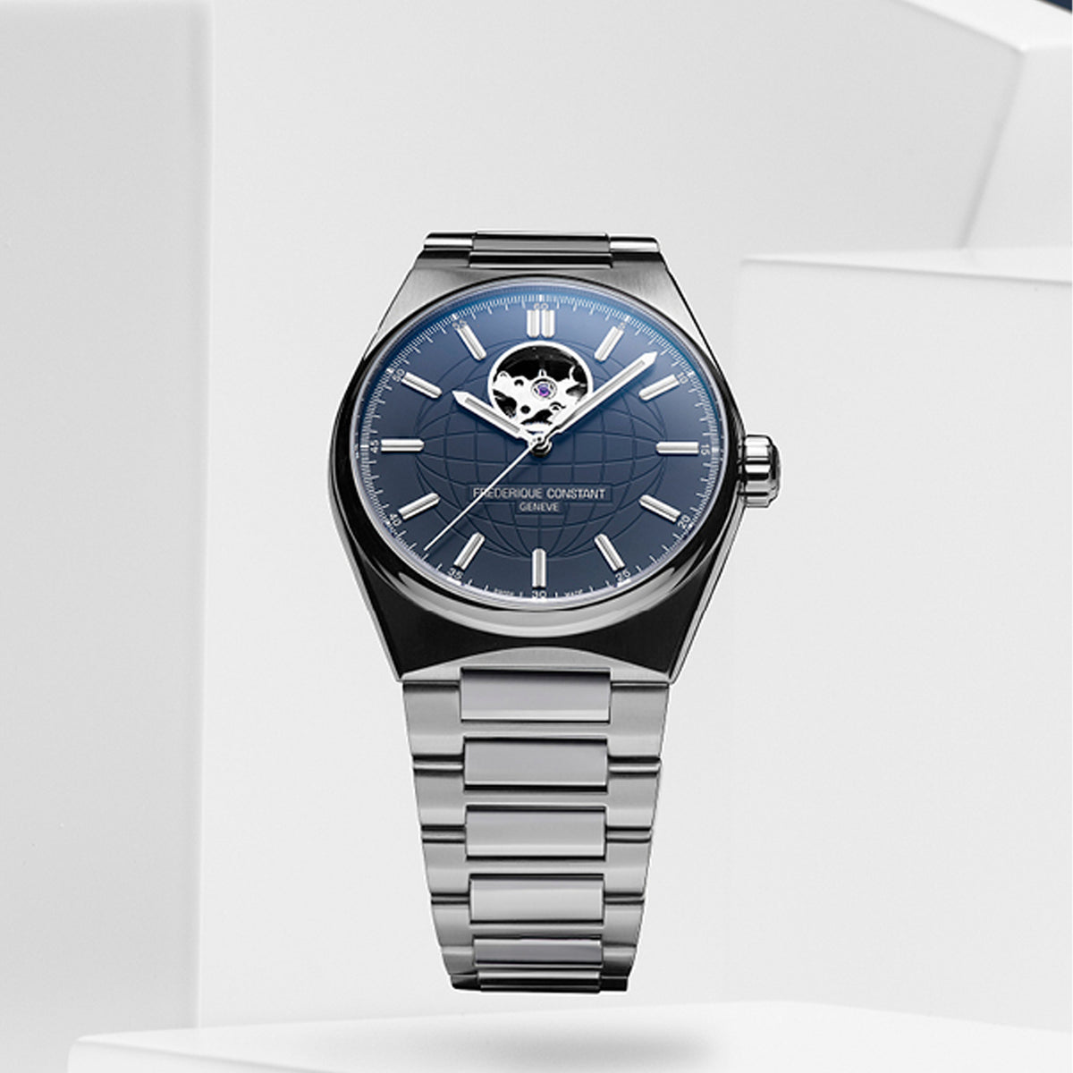 Frederique Constant Men's 41mm Stainless Steel Automatic Watch FC-310N4NH6B viewed front-on, showing the blue matt dial with an embossed globe pattern and applied indexes. An open heart aperture at 12 o'clock reveals part of the movement, with silver hands set against the dial.