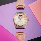 Frederique Constant Highlife Automatic Women's 34mm Watch FC-310VD2NH2B styled in a lifestyle setting, reflecting its versatile design for both everyday and dressier occasions. The two-tone finish and diamond-set dial complement a range of outfits.