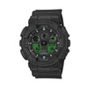 Casio G-Shock GA100BEG-1A front view, featuring the large 55mm all-black round resin case with electro green LCD accents, three-dial analogue-digital layout with aluminium hands, four symmetrical LCD windows, oversized checkered anti-slip buttons, and bold G-Shock branding in a striking black and electro green colourway.