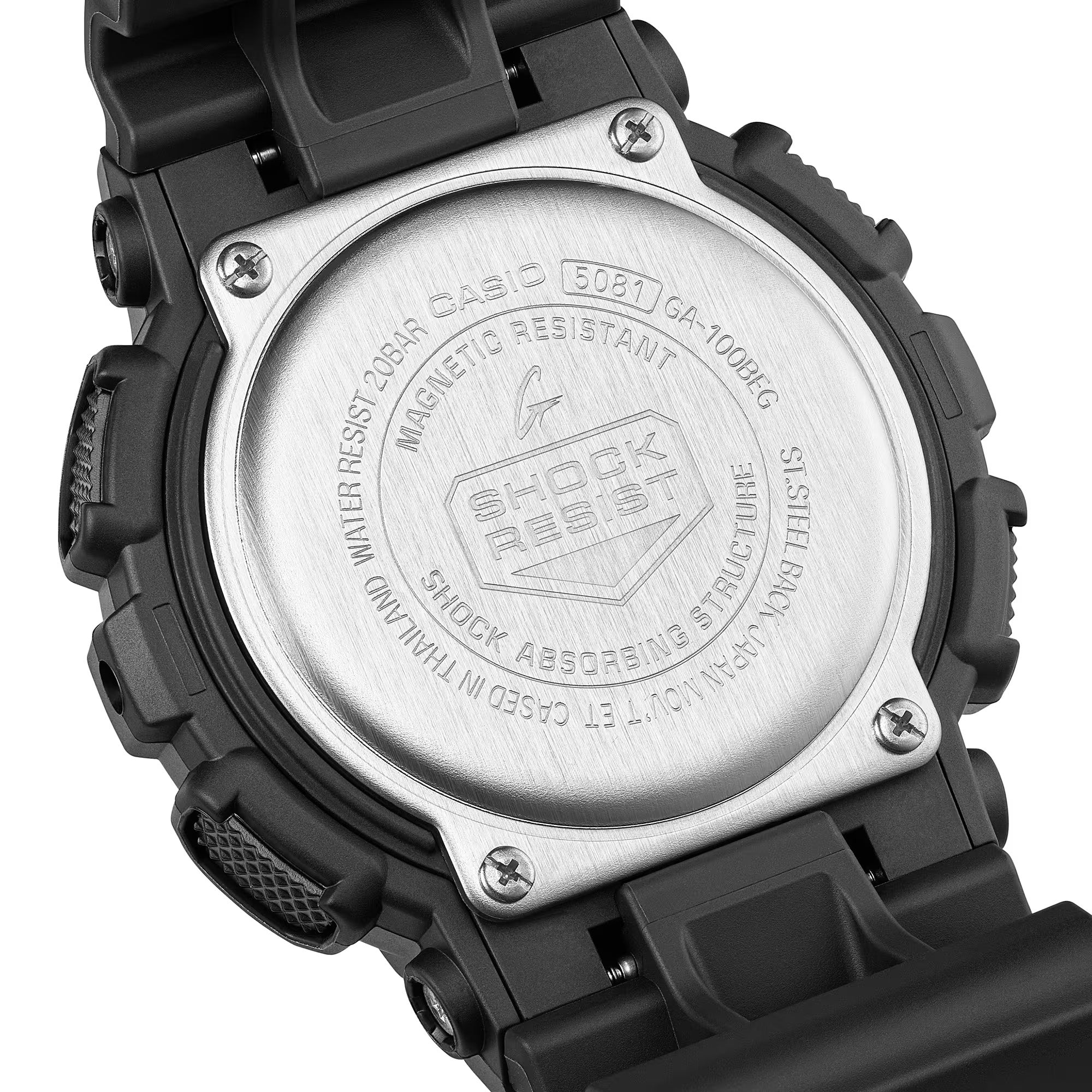 Casio G-Shock GA100BEG-1A watch rear view showing the stainless steel case back with G-Shock branding and module details, confirming shock-resistant, magnetic-resistant, and 200-metre water-resistant construction.