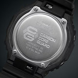Casio G-Shock GA-2100-1A1 watch rear view showing the four-screw stainless steel case back engraved with the Carbon Core Guard logo and G-Shock branding, confirming the watch's shock-resistant and 200-metre water-resistant credentials.