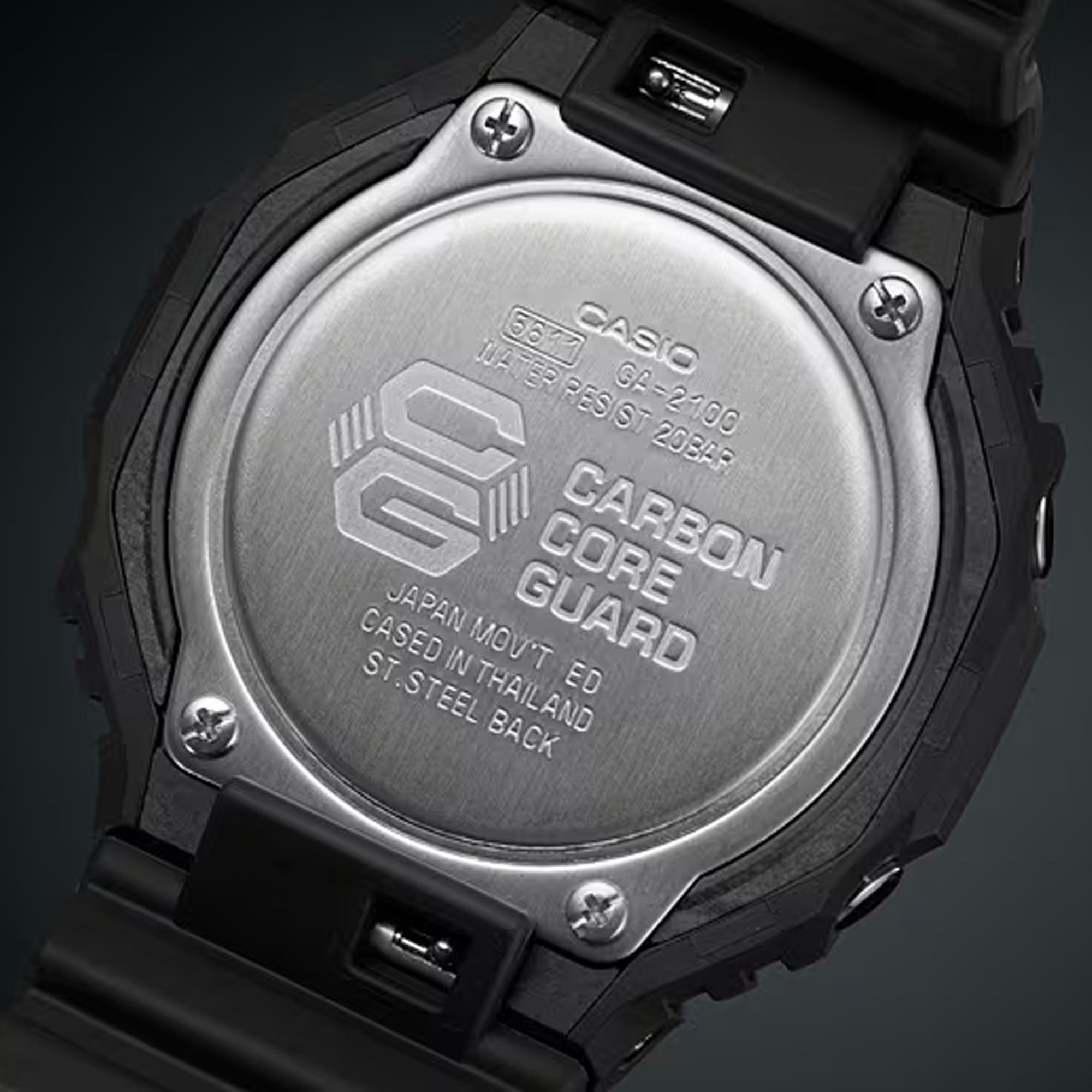 Casio G-Shock GA-2100-1A1 watch rear view showing the four-screw stainless steel case back engraved with the Carbon Core Guard logo and G-Shock branding, confirming the watch's shock-resistant and 200-metre water-resistant credentials.