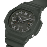 Three-quarter angle view of the Casio G-SHOCK 2500 Series Quartz Men’s Watch GAC2500-3A, 46.7mm case, highlighting the green resin bezel and rounded octagonal case. The green dial and raised bar indexes are visible.