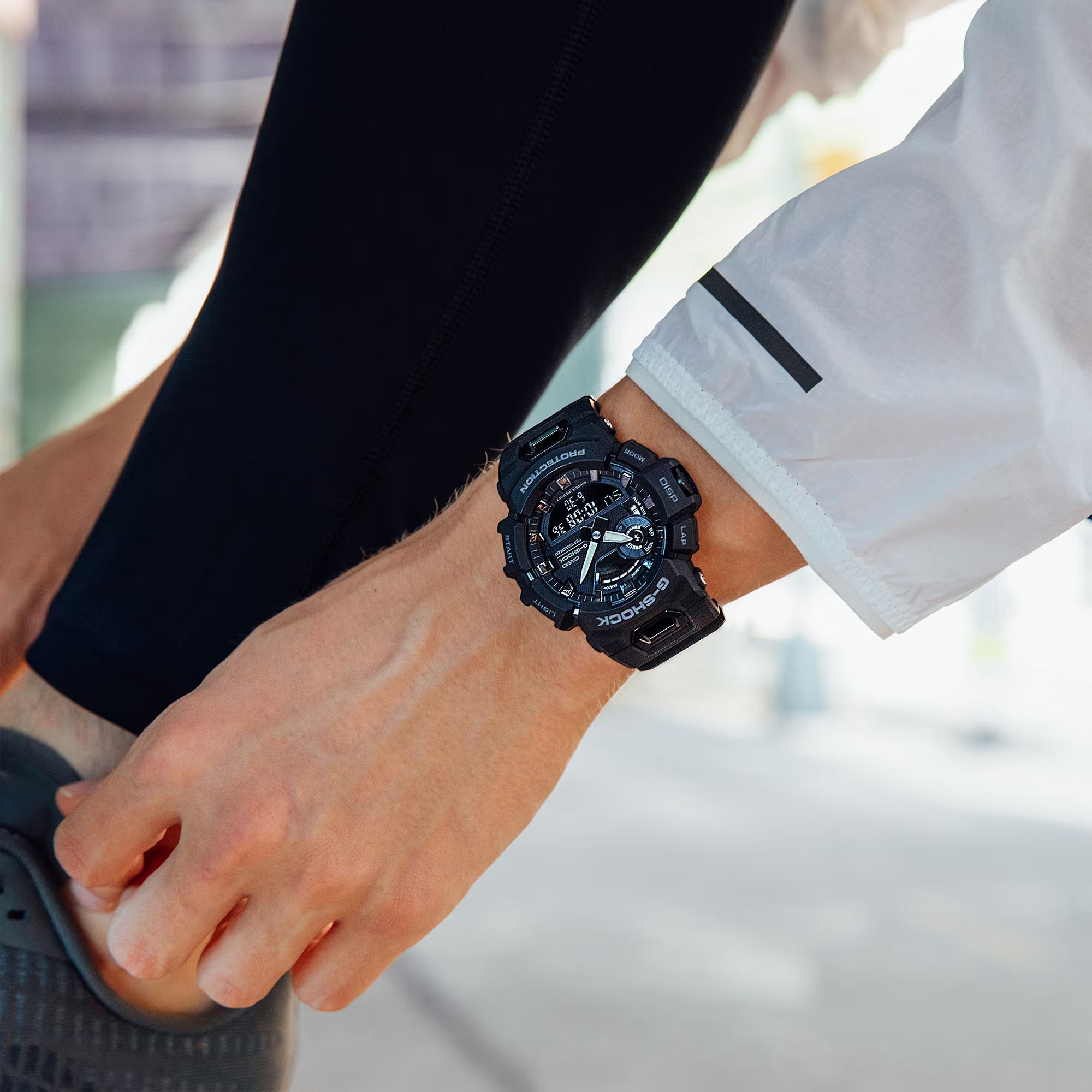 Casio G-SHOCK GBA900-1A analogue digital sport watch with black resin band, fitness tracking features, and shock-resistant design - on hand