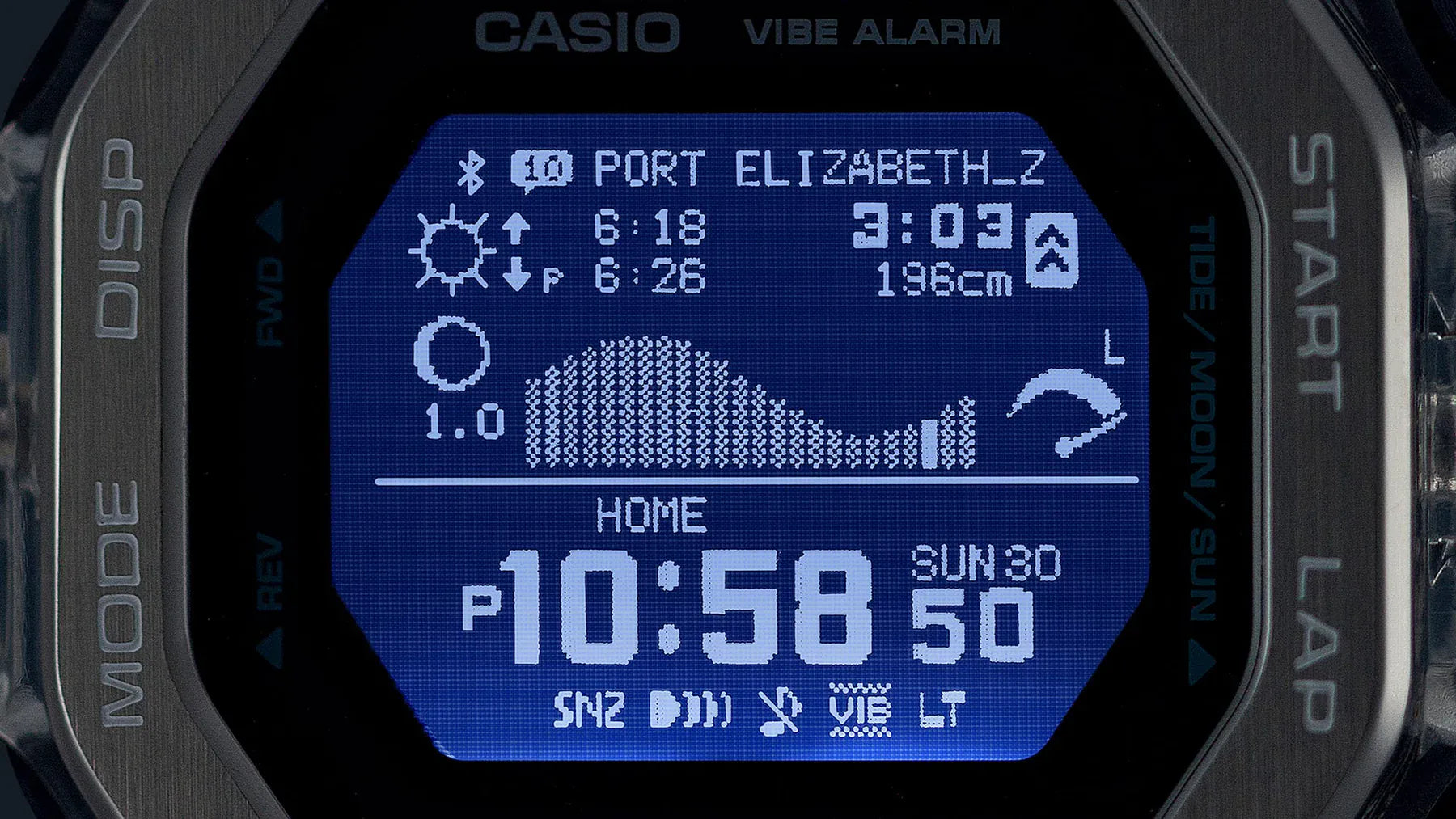 Casio G-SHOCK G-LIDE GBX100S-2D digital watch front view, featuring a square-case design with a dual-material bezel of stainless steel and translucent purple resin, high-definition MIP LCD display, and silver-tone accents.