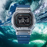 Casio G-LIDE GBXH5600-2D Blue Digital Watch shown submerged amid ocean waves, reflecting its water-ready design. Translucent bezel and digital display remain visible even in an underwater setting.