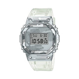 Casio G-SHOCK GM5600SCM-1 digital watch with stainless steel bezel, translucent skeleton resin band, camouflage dial print, and shock-resistant design.