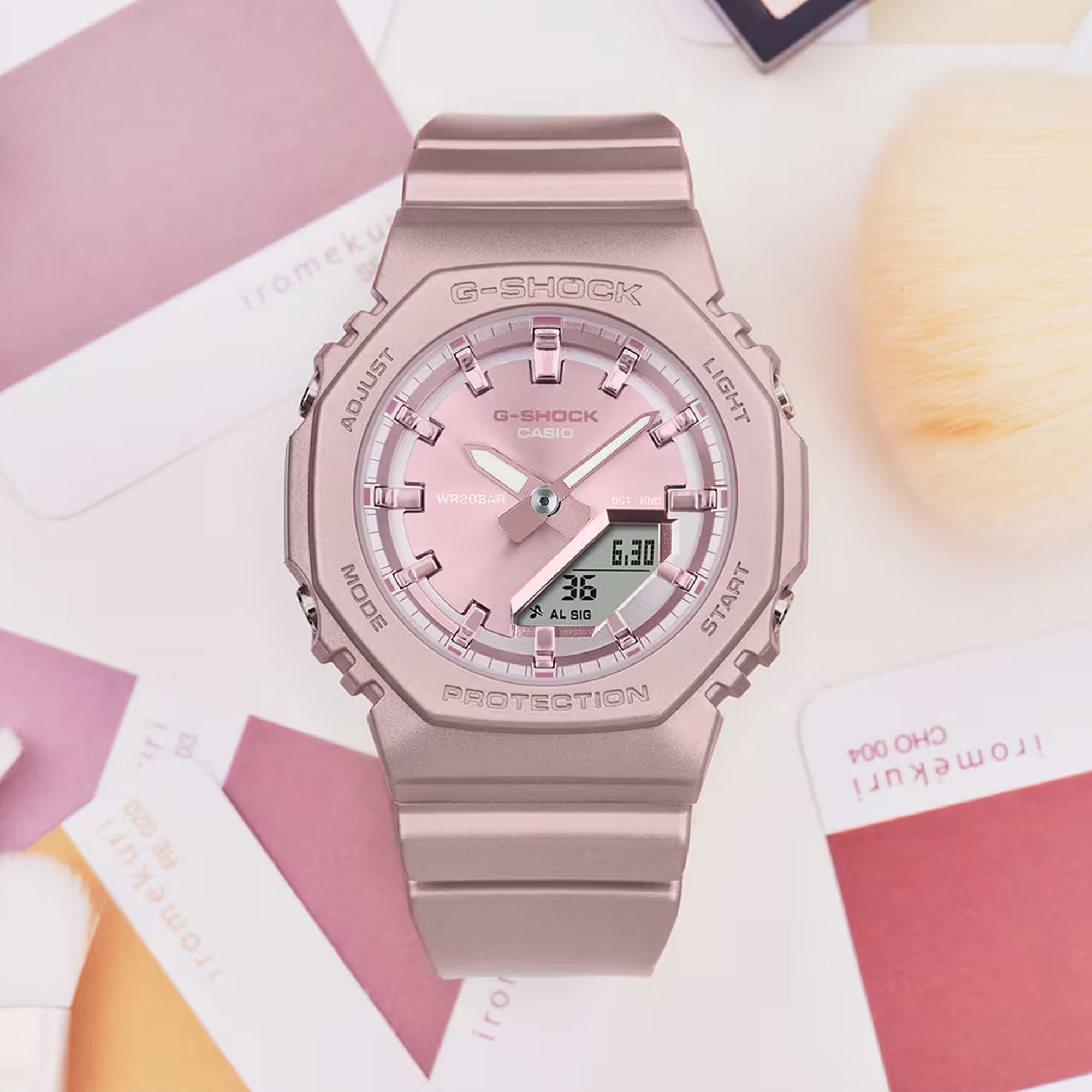 Casio G-Shock GMAP2100ST-4AD front view — pearlescent matte pink octagonal bio-based resin case and band, metallic vapour deposition pink dial, minimalist analogue-digital display. 46mm x 40.2mm x 11.2mm, 40 grams, shock resistant, 200M water resistant.
