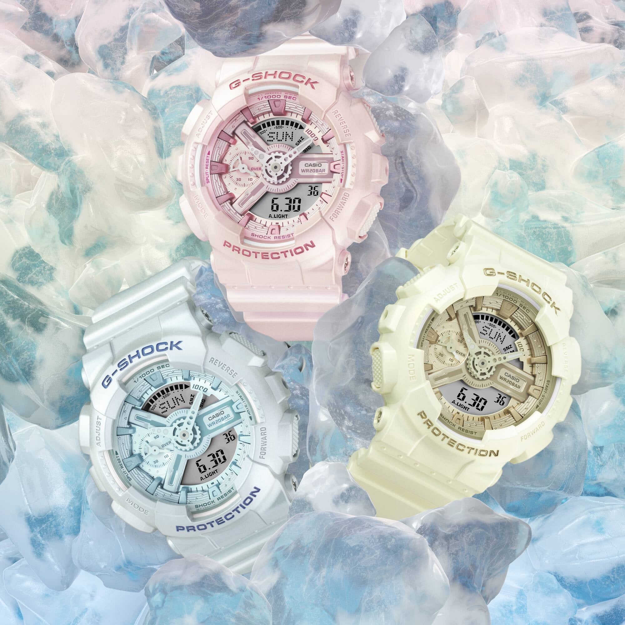 Three G-Shock watches in pink, white, and yellow on a textured blue and white background.