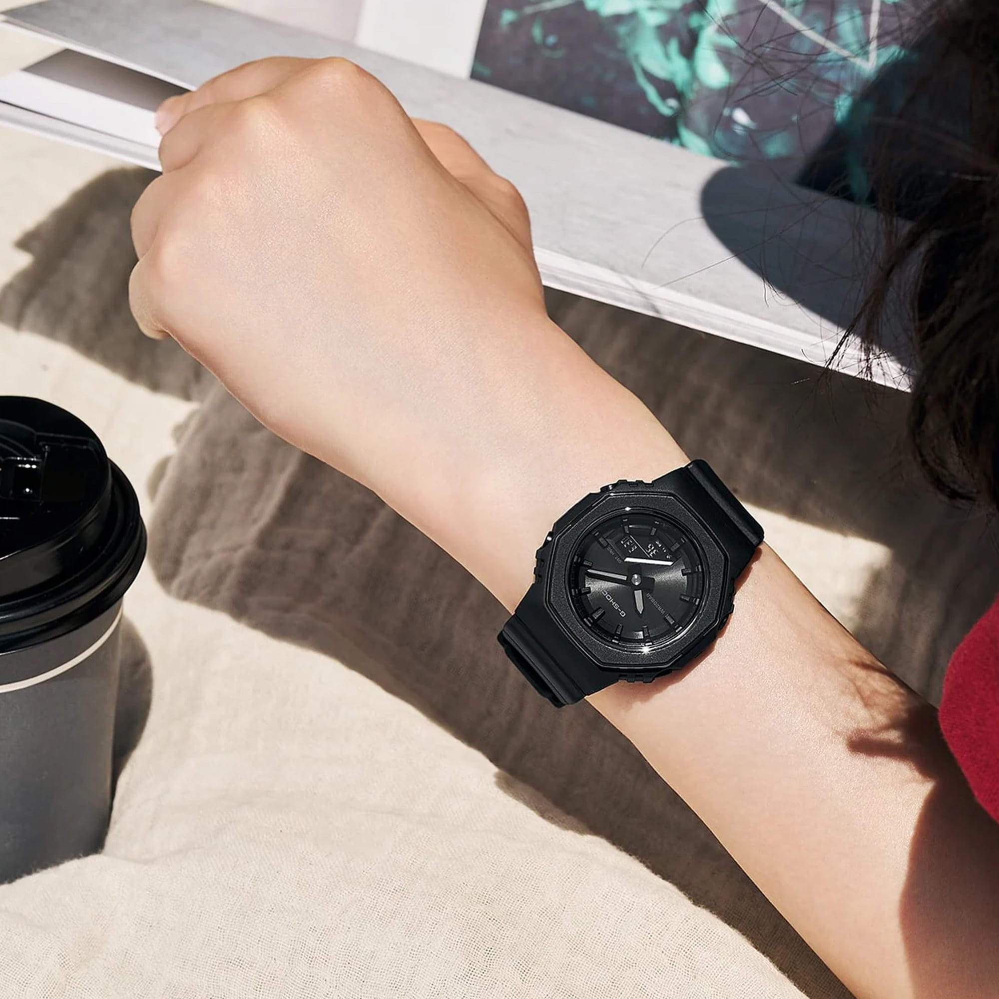 The Casio G-SHOCK Analogue Digital Women's Watch GMA-P2110B-1A, 40.5mm case, worn on the wrist to show scale and fit. The compact all-black design suits smaller wrists for everyday wear.