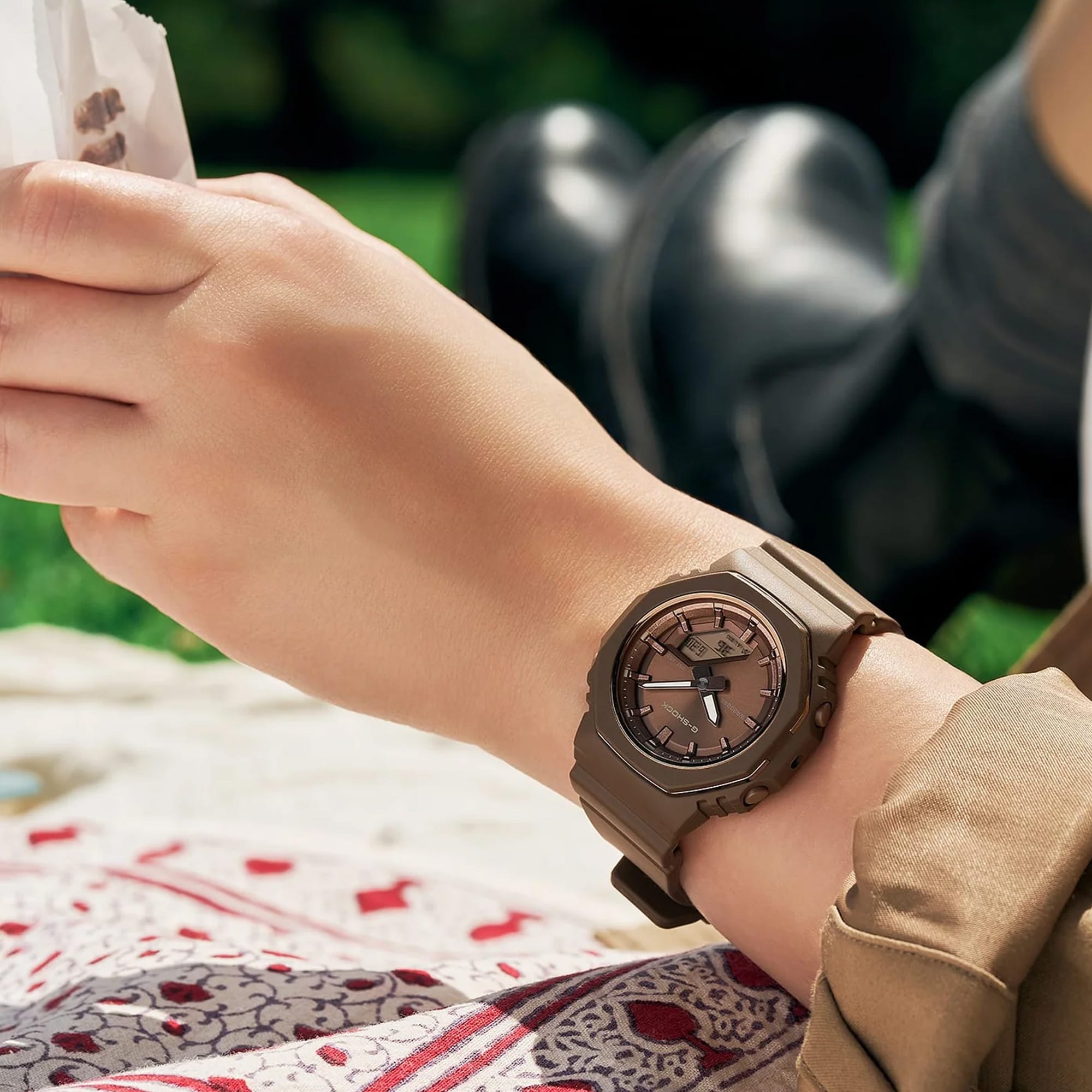 The Casio G-SHOCK Analogue Digital Women's Watch GMA-P2110B-5A, 40.5mm case, worn on the wrist to show scale and fit. The compact all-brown design suits smaller wrists for everyday wear.