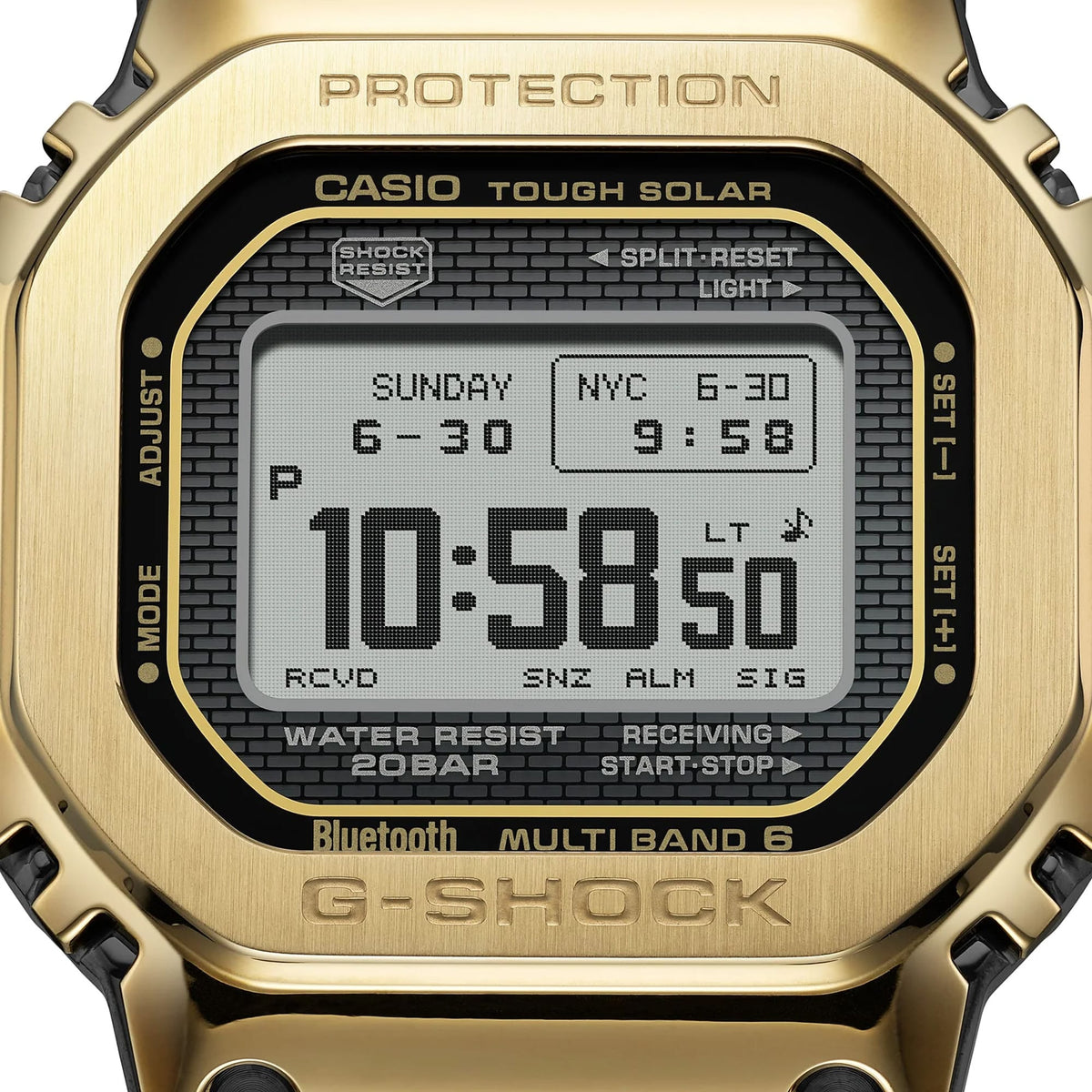 Close-up of the digital display on the Casio G-SHOCK Full Metal GMW-B5000GD-9 Men's Digital Watch, 49mm case, showing the time, date and black dial detail against the gold-tone case. The gold ion-plated finishing on the stainless steel bezel is also visible.