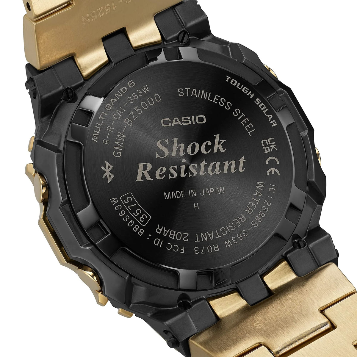 Back of the gold-tone stainless steel band on the Casio G-SHOCK Full Metal GMW-B5000GD-9 Men's Digital Watch, 49mm case. The dimpled metal band links and fold-over clasp are shown in detail.
