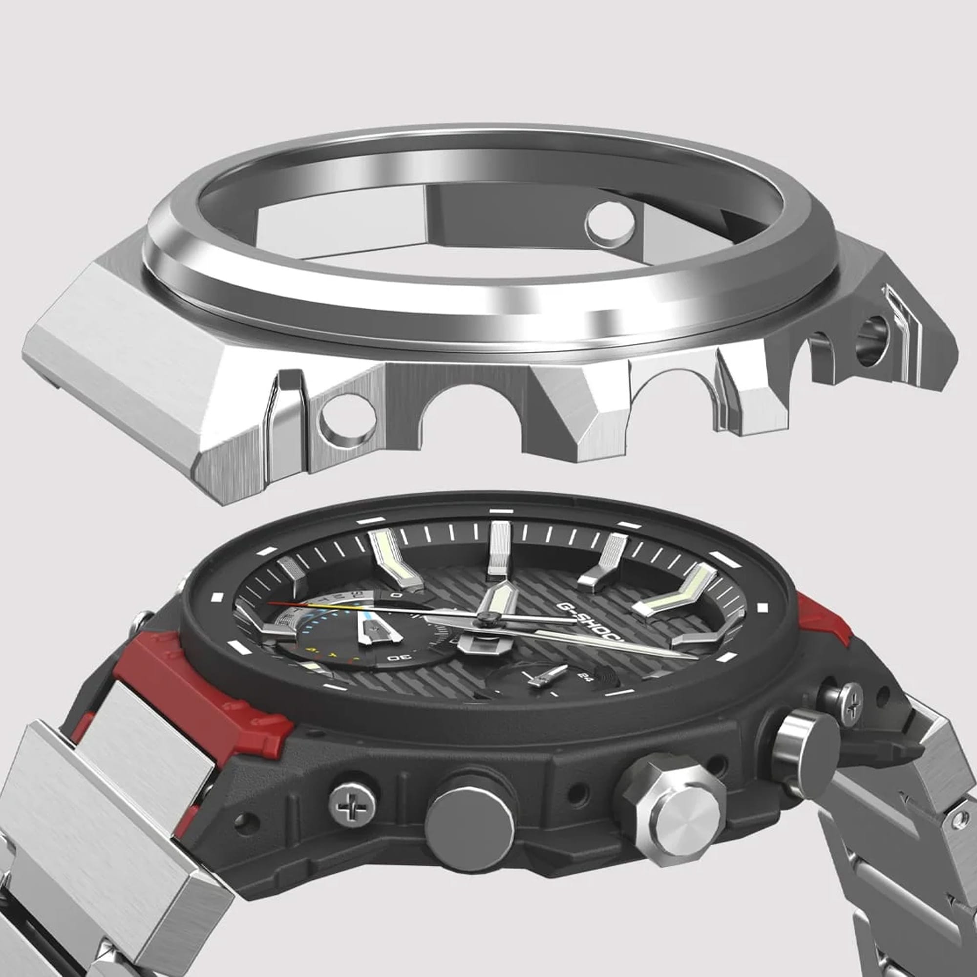 A close-up of a rugged analog watch with a black textured dial, silver-tone bezel, and red accents on the side, shown against a light gray background.