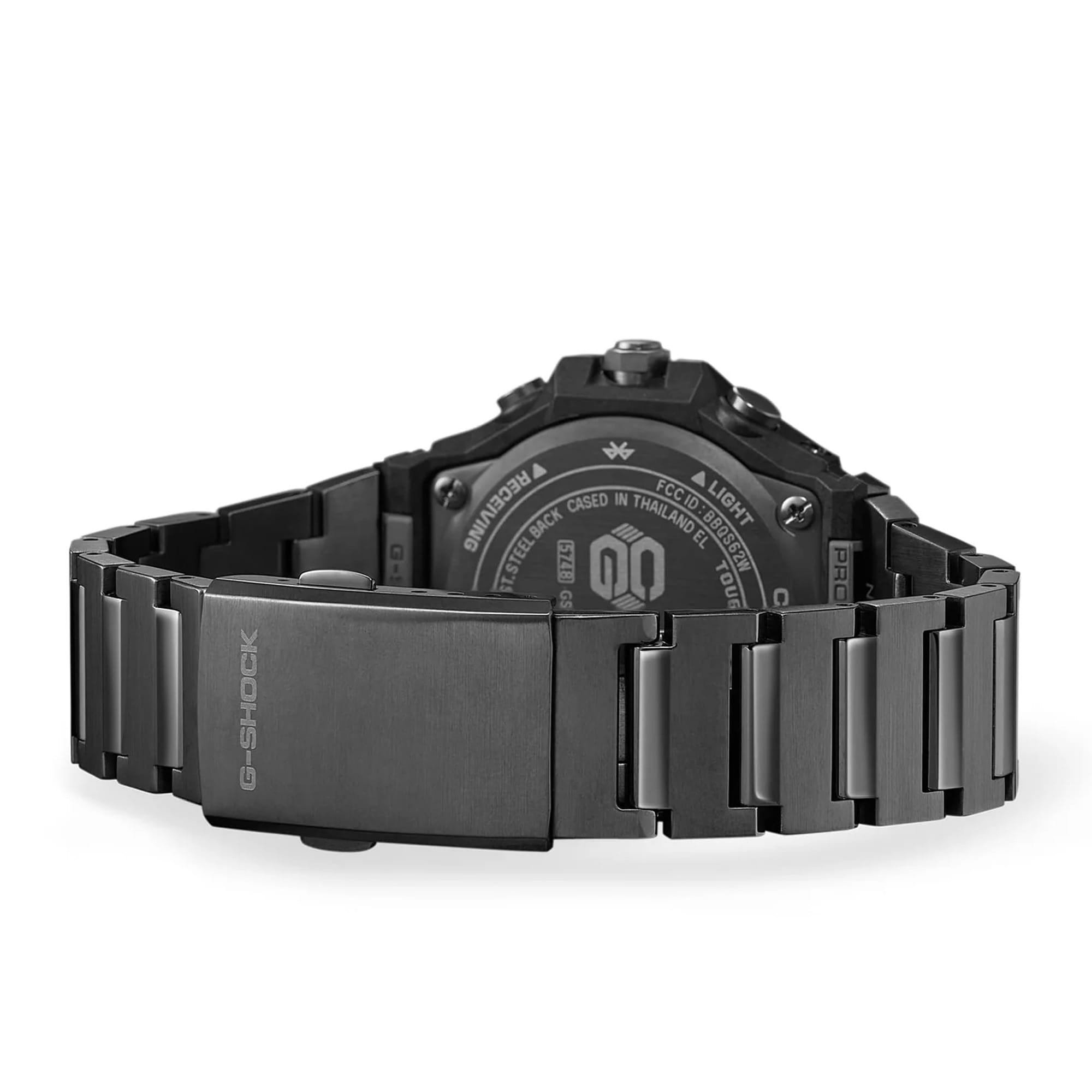 The Casio G-Shock G-Steel Solar Men's Watch GSTB1000BD-1A is fitted with a solid stainless steel bracelet combining hairline and mirror finishes, secured by a black ion-plated tri-fold clasp — with the all-black ion-plated case back confirming shock-resistant and 200-metre water-resistant construction.
