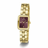 The Guess GW0865L9 is shown face-on, highlighting its 28mm gold-tone rectangular case and sleek burgundy dial. A touch of crystal adorns the case for a subtle, refined sparkle.