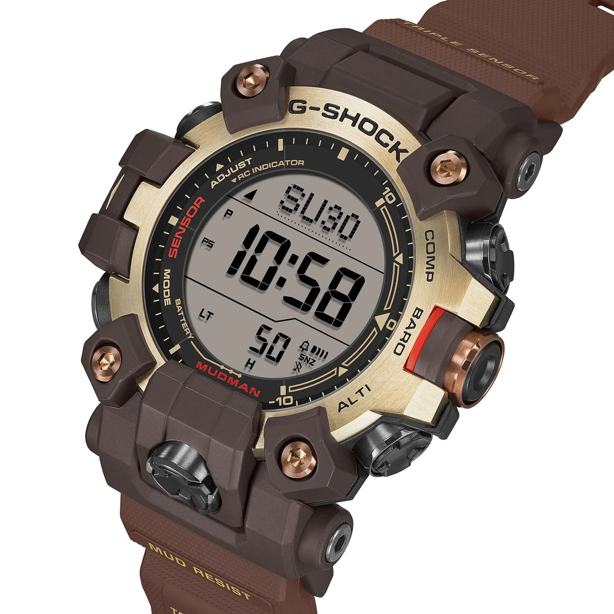 Three-quarter angle view of the Casio G-SHOCK Solar Men's Watch GW-9500MH-5, 53mm case, highlighting the mud-resistant guarded buttons and gold ion-plated bezel detailing. The duplex LCD display is visible from this angle.