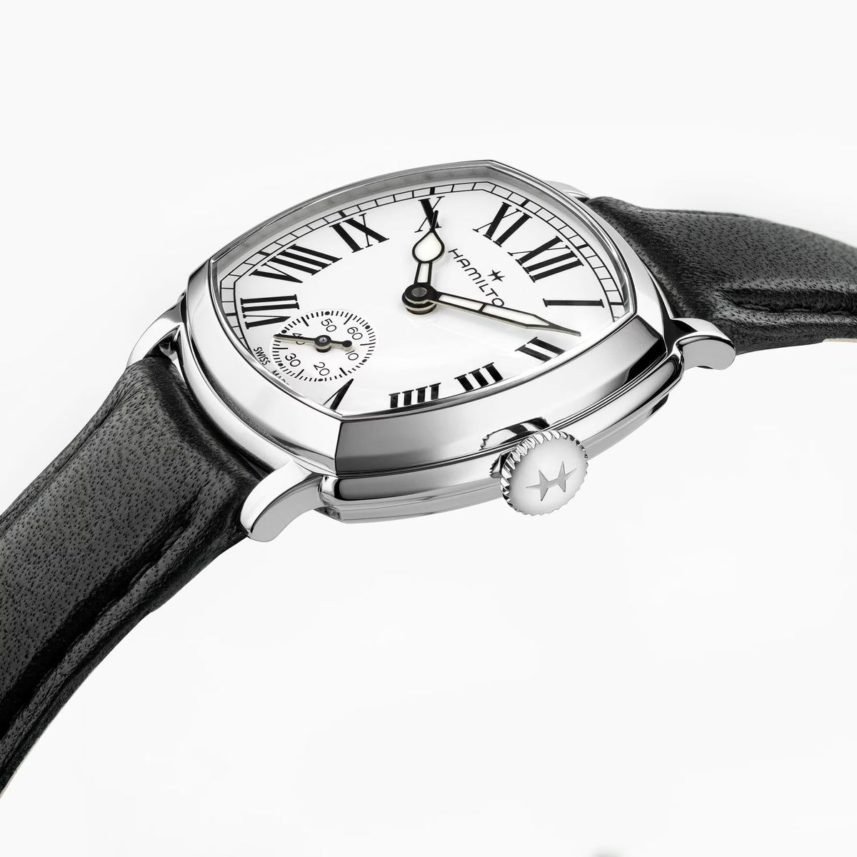 Hamilton American Classic Cushion Mechanical Women’s 30mm Watch H36109710 is shown in close up, revealing the black Roman numerals, railway minute track and small seconds sub-dial. The slim hands stand out against the white dial.