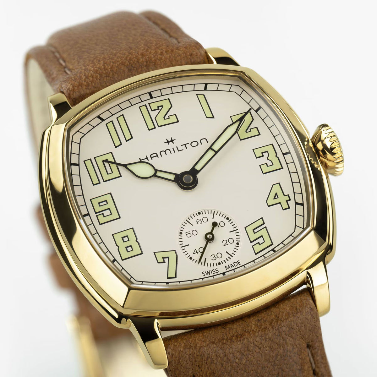 Hamilton American Classic Cushion Mechanical Women’s 30mm Watch H36119520 is shown in close up, revealing the beige dial and its fine hour markers. The slim luminous hands stand out against the dial.